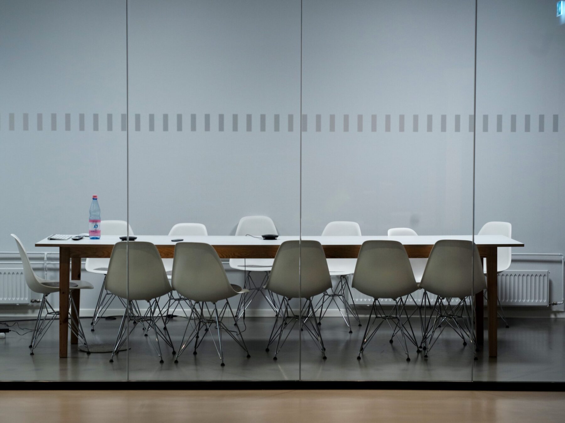 empty table with grey chairs showing whether the great resignation was a symptom of societies deeper problems