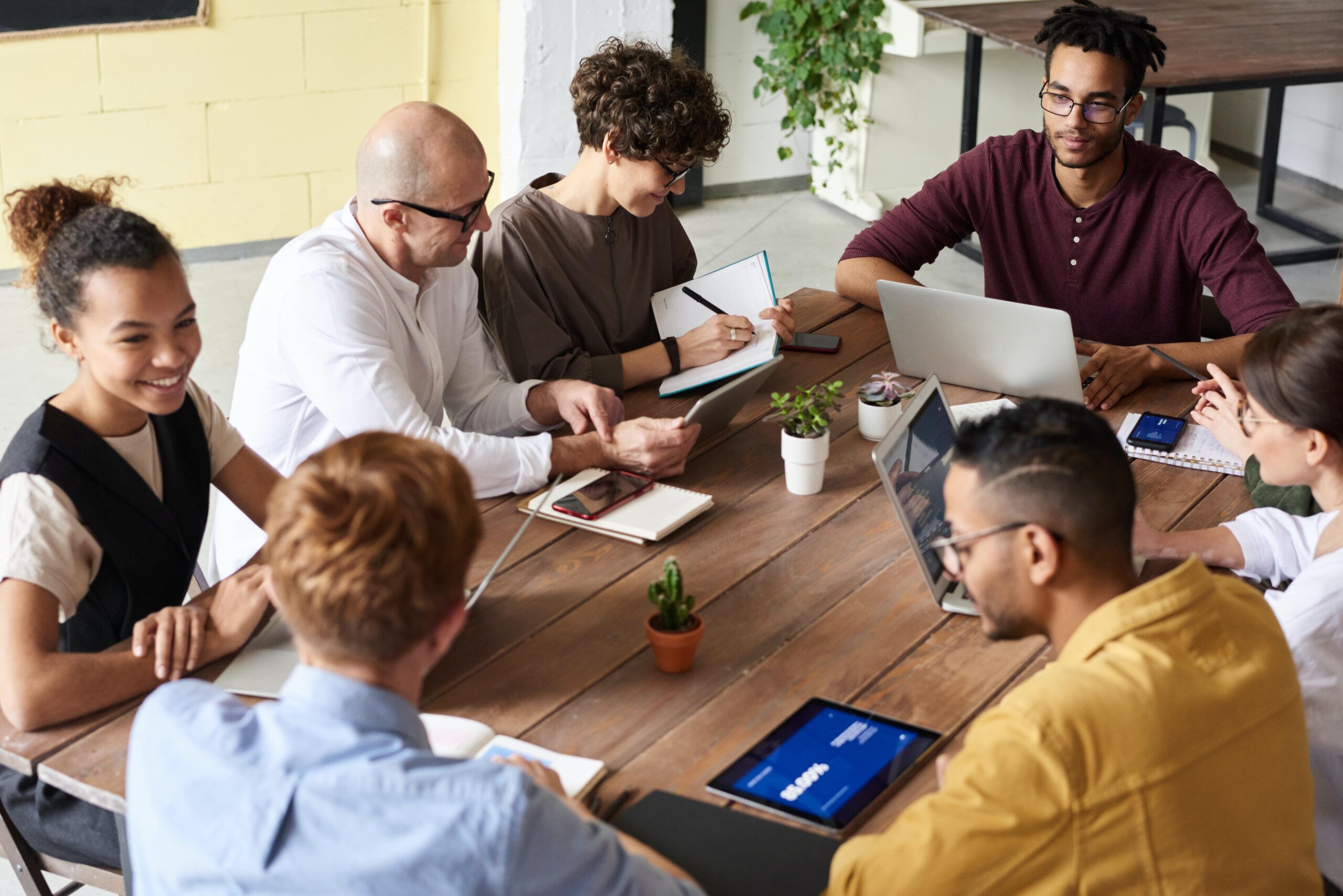 A team at work forming new workplace habits to improve company culture